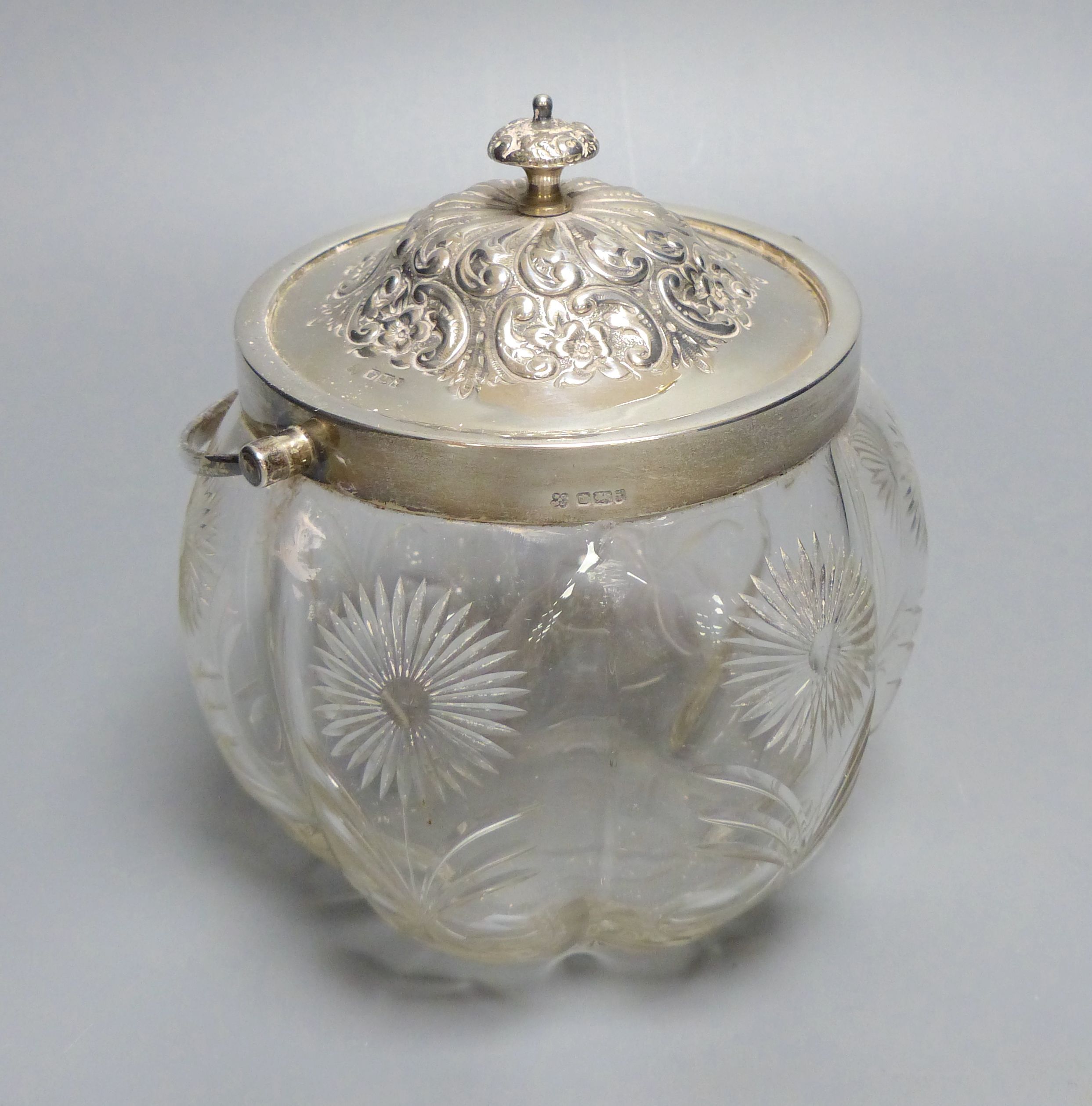 An Edwardian silver mounted glass biscuit barrel, Boardman, Glossop & Co, Sheffield, 1901, height 16.5cm.